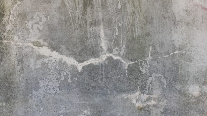 Weathered concrete surface with fine cracking and staining
